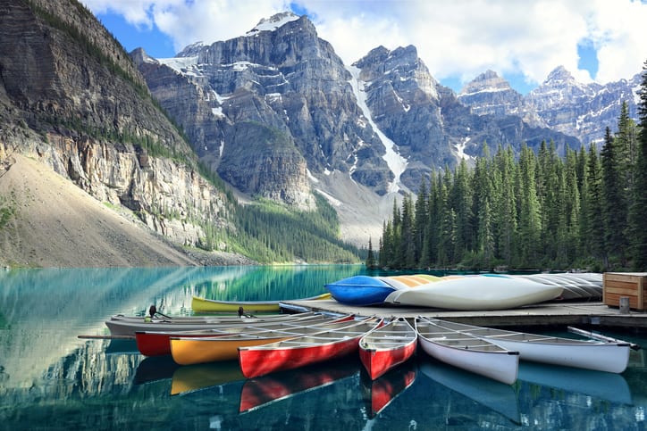 Canoes on a jetty at Moraine lake, Banff national park in the Rocky Mountains, Alberta, Canada - things to do in banff national park - summer